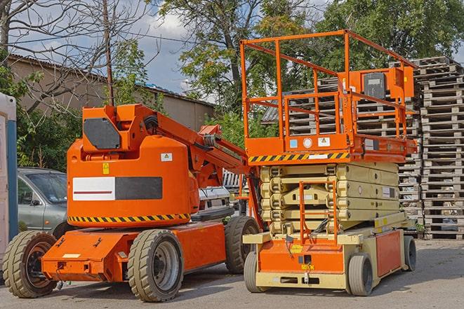 forklift operator working in busy warehouse environment in Groveland